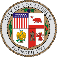 the official seal of the City of Los Angeles: outer circle is a 77-bead rosary border representing the California Spanish missions; flanking the central escutcheon are grapes, olives, and oranges representing major California crops. The escutcheon contains four quarters: (clockwise from upper left) USA lesser coat of arms, 1846 California flag, Mexican coat of arms, and the Spanish lesser coat of arms of (1785-1873).
